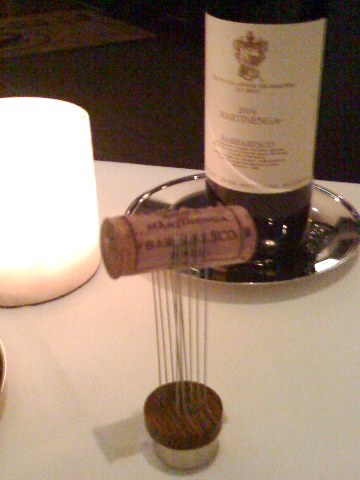 cork bdsm? the cork pulled from our barbaresco, trapped between two rows of long pins on a small pedestal